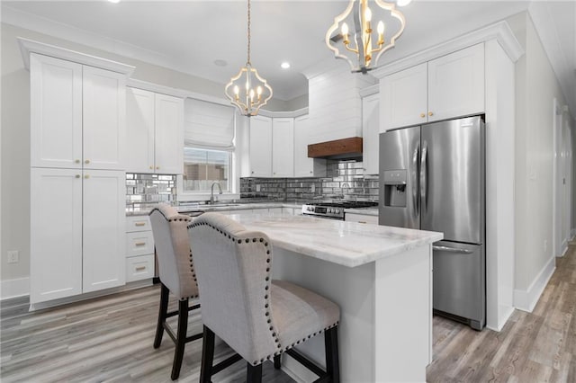 2028 Charles Dr, Chalmette, LA 70043 - kitchen featuring appliances with stainless steel finishes, a chandelier, recessed lighting, and white cabinetry