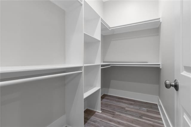 2028 Charles Dr, Chalmette, LA 70043 - walk in closet with wood finished floors