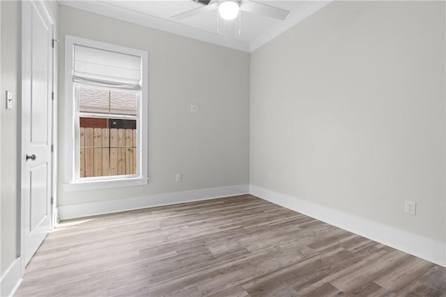 2028 Charles Dr, Chalmette, LA 70043 - empty room featuring ceiling fan, wood finished floors, and ornamental molding
