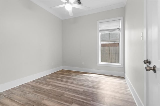 2028 Charles Dr, Chalmette, LA 70043 - spare room featuring wood finished floors, a ceiling fan, and crown molding
