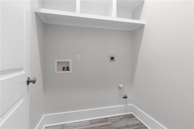 2028 Charles Dr, Chalmette, LA 70043 - laundry room with hookup for a washing machine, wood finished floors, electric dryer hookup, and hookup for a gas dryer
