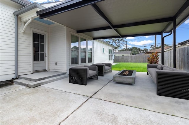 2028 Charles Dr, Chalmette, LA 70043 - fenced backyard with an outdoor living space with a fire pit and a patio area
