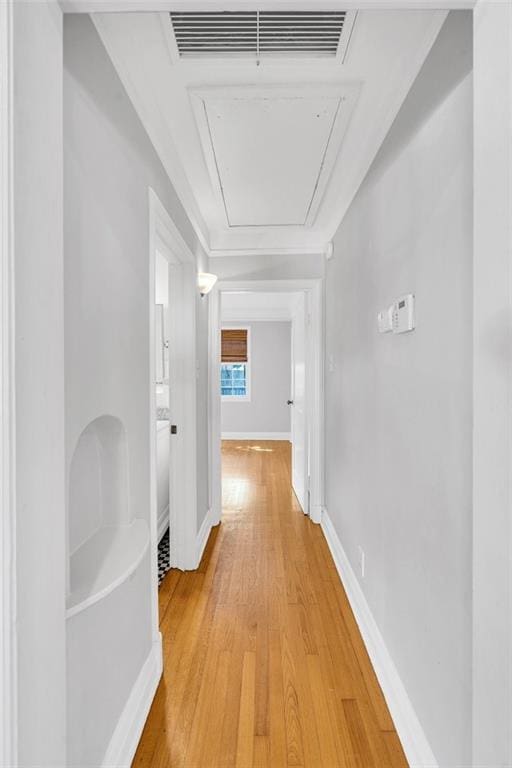 107 Melody Dr, Metairie, LA 70001 - corridor featuring attic access and light wood-type flooring