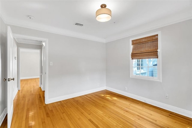 107 Melody Dr, Metairie, LA 70001 - unfurnished room with ornamental molding, light wood-style flooring, and a smoke detector