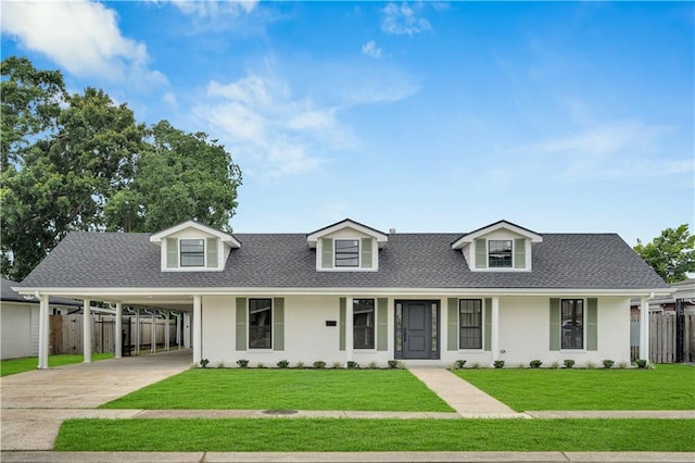 1208 Madison St, Metairie, LA 70001 - cape cod home featuring concrete driveway, a shingled roof, brick siding, and a carport