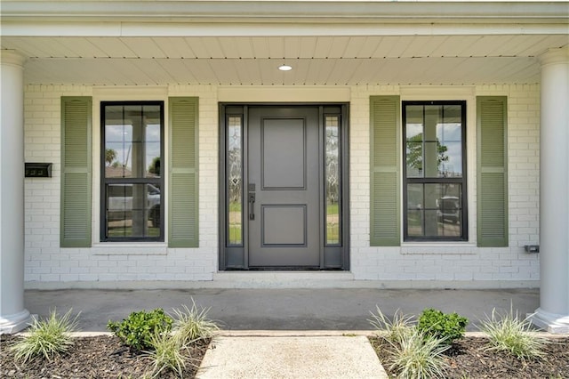 1208 Madison St, Metairie, LA 70001 - view of exterior entry with covered porch and brick siding