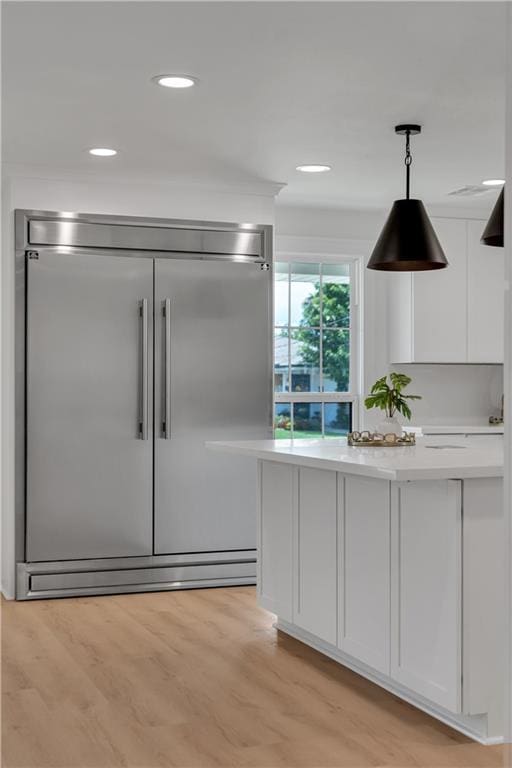 1208 Madison St, Metairie, LA 70001 - bar with built in fridge, pendant lighting, light wood-style floors, and recessed lighting