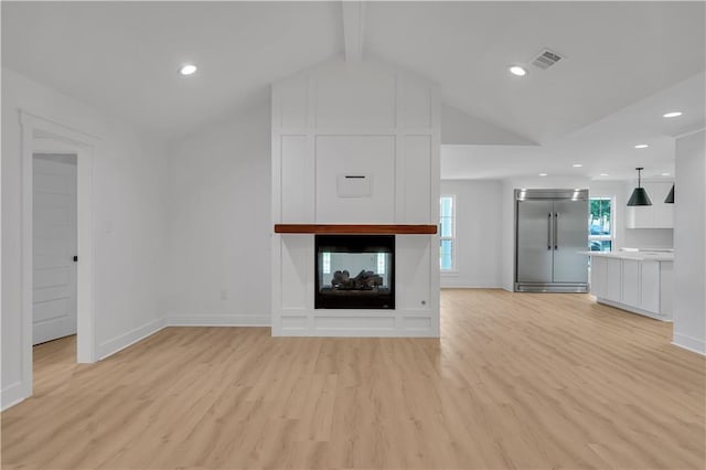 1208 Madison St, Metairie, LA 70001 - unfurnished living room with light wood finished floors, recessed lighting, and a multi sided fireplace