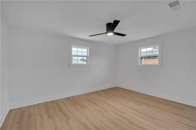 1208 Madison St, Metairie, LA 70001 - empty room featuring plenty of natural light, light wood-style floors, and ceiling fan