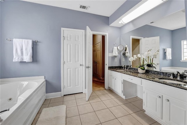 2004 Dierdorff Ct, Slidell, LA 70461 - full bath featuring double vanity, a whirlpool tub, and tile patterned floors