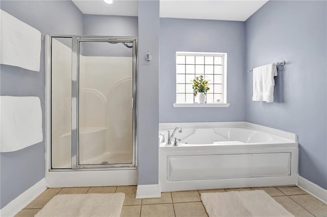 2004 Dierdorff Ct, Slidell, LA 70461 - bathroom featuring a stall shower, tile patterned flooring, and a garden tub