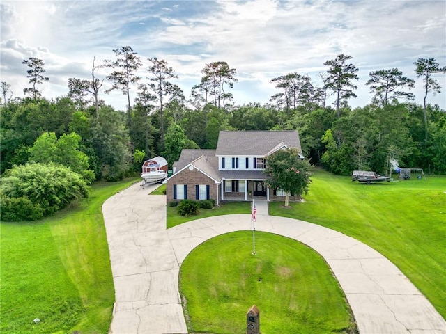 2004 Dierdorff Ct, Slidell, LA 70461 - view of front of home featuring curved driveway, a front lawn, and a porch
