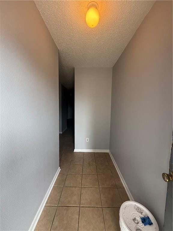 3112 Phoenix St Unit D, Kenner, LA 70065 - empty room with tile patterned flooring and a textured ceiling