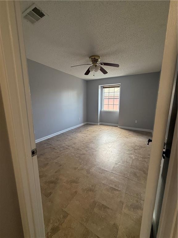 3112 Phoenix St Unit D, Kenner, LA 70065 - unfurnished room with a ceiling fan and a textured ceiling