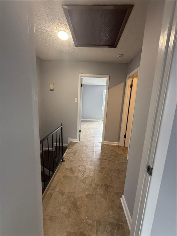 3112 Phoenix St Unit D, Kenner, LA 70065 - hall with an upstairs landing, attic access, and stone finish flooring
