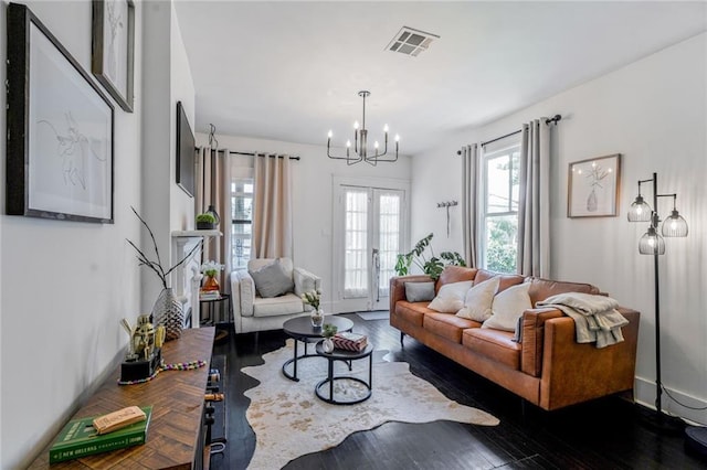 2231 Constance St, New Orleans, LA 70130 - living area featuring a chandelier and wood finished floors