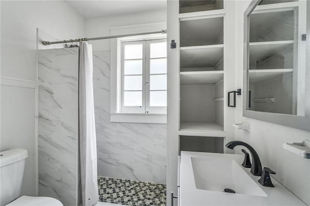 2231 Constance St, New Orleans, LA 70130 - bathroom with a marble finish shower and vanity