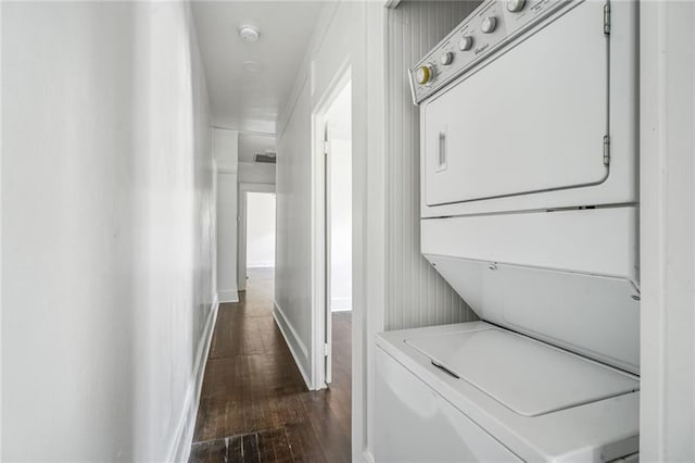 2231 Constance St, New Orleans, LA 70130 - laundry area with estacked washer and dryer and dark wood-type flooring