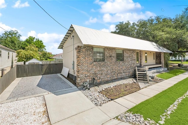 6000 Franklin Ave, New Orleans, LA 70122 - view of front of property featuring brick siding and gravel driveway