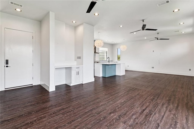 6000 Franklin Ave, New Orleans, LA 70122 - unfurnished living room with ceiling fan, dark wood-type flooring, and recessed lighting