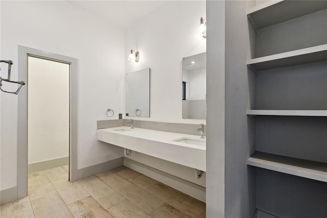 6000 Franklin Ave, New Orleans, LA 70122 - bathroom with double vanity and baseboards