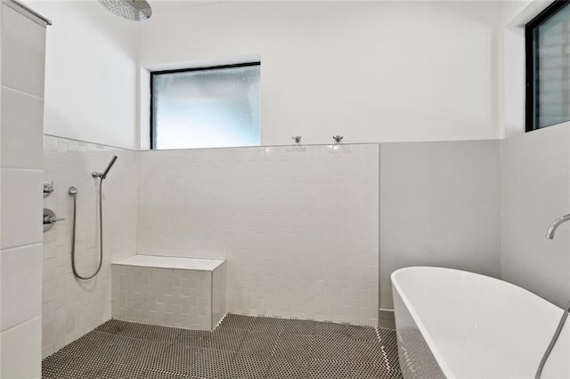 6000 Franklin Ave, New Orleans, LA 70122 - full bath featuring tiled shower, a soaking tub, and tile patterned flooring