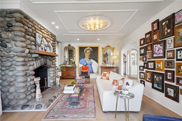 1455 Moss St, New Orleans, LA 70119 - living room with wood finished floors, a fireplace, arched walkways, and recessed lighting