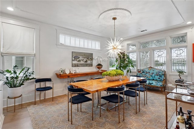 1455 Moss St, New Orleans, LA 70119 - dining area with wood finished floors, a chandelier, and recessed lighting