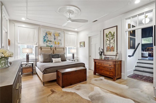 1455 Moss St, New Orleans, LA 70119 - bedroom with light wood-type flooring, recessed lighting, and multiple windows