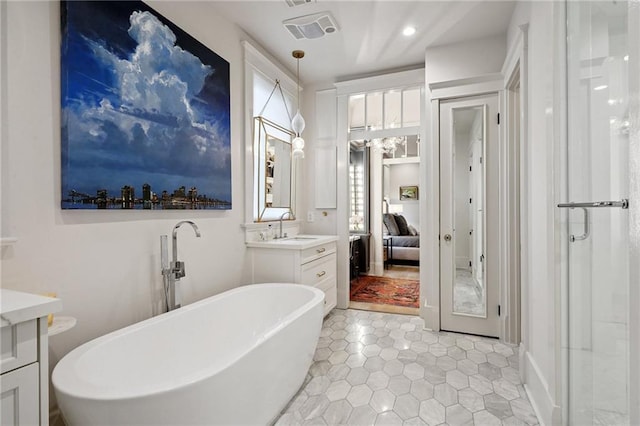 1455 Moss St, New Orleans, LA 70119 - full bath with vanity, a soaking tub, connected bathroom, tile patterned flooring, and a stall shower