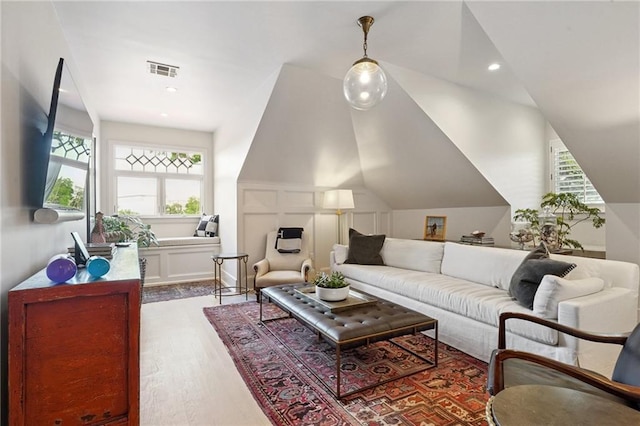 1455 Moss St, New Orleans, LA 70119 - living room featuring wood finished floors, lofted ceiling, and recessed lighting