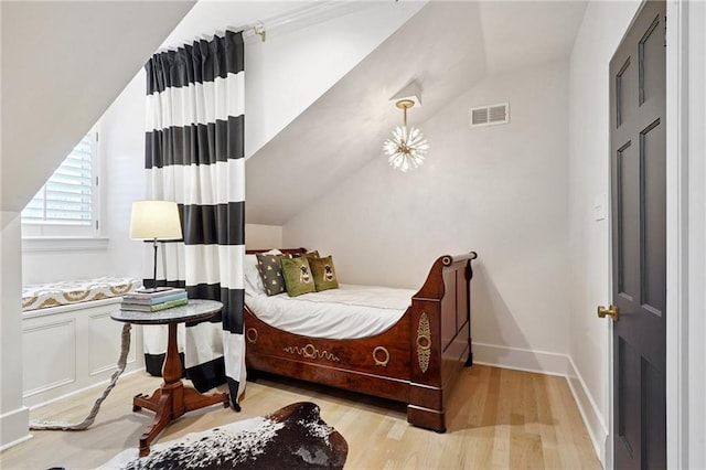 1455 Moss St, New Orleans, LA 70119 - bedroom with wood finished floors and lofted ceiling