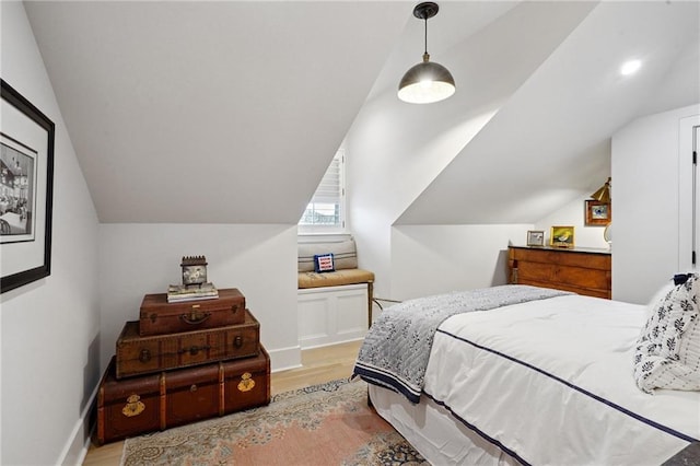 1455 Moss St, New Orleans, LA 70119 - bedroom with light wood finished floors and vaulted ceiling