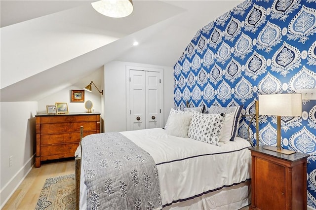 1455 Moss St, New Orleans, LA 70119 - bedroom featuring vaulted ceiling, wood finished floors, a closet, and recessed lighting