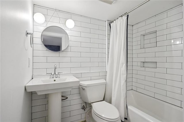 1455 Moss St, New Orleans, LA 70119 - bathroom with shower / tub combo with curtain and tile walls