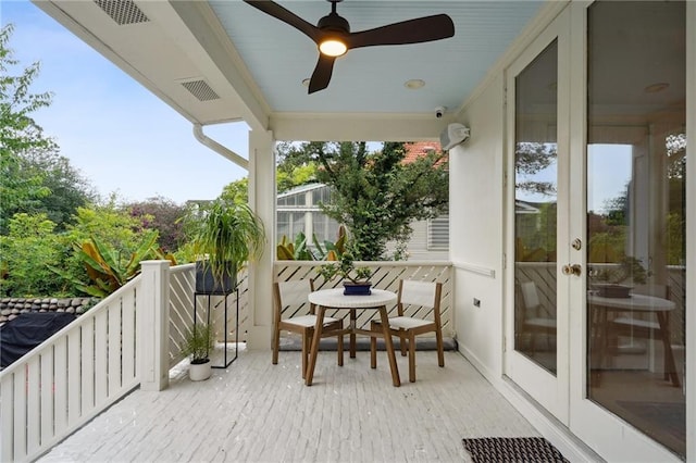1455 Moss St, New Orleans, LA 70119 - balcony featuring a ceiling fan and french doors
