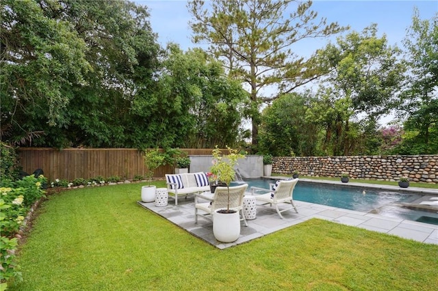 1455 Moss St, New Orleans, LA 70119 - fenced backyard with a patio area and an outdoor hangout area