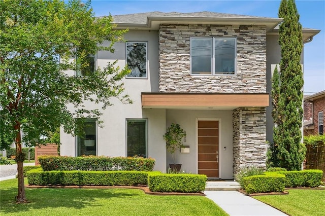 800 Ridgelake Dr, Metairie, LA 70001 - view of front facade featuring stone siding, stucco siding, and a front lawn