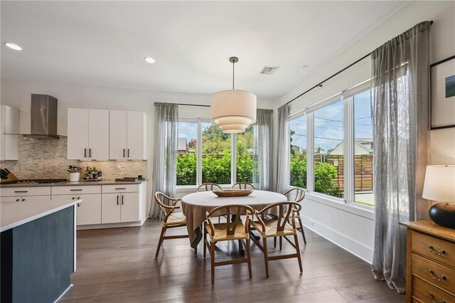 800 Ridgelake Dr, Metairie, LA 70001 - dining room with dark wood-style floors and recessed lighting
