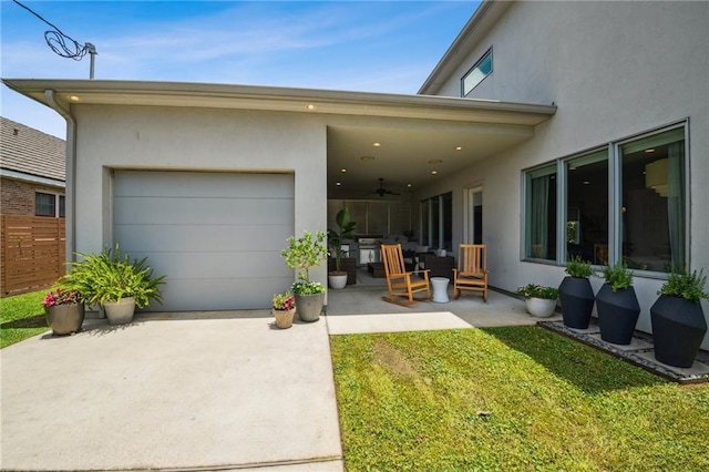 800 Ridgelake Dr, Metairie, LA 70001 - garage featuring ceiling fan and concrete driveway