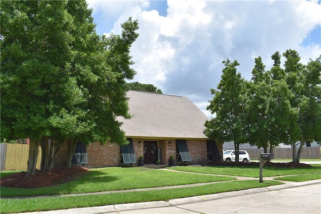 14 Platt St, Kenner, LA 70065 - view of property hidden behind natural elements featuring brick siding