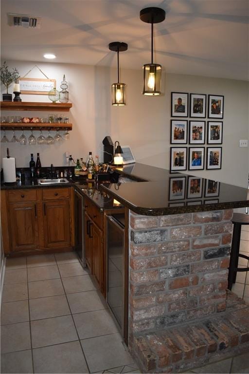 14 Platt St, Kenner, LA 70065 - indoor wet bar featuring light tile patterned flooring, decorative light fixtures, and recessed lighting
