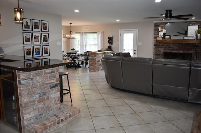 14 Platt St, Kenner, LA 70065 - living area featuring a fireplace, light tile patterned flooring, recessed lighting, a chandelier, and a ceiling fan
