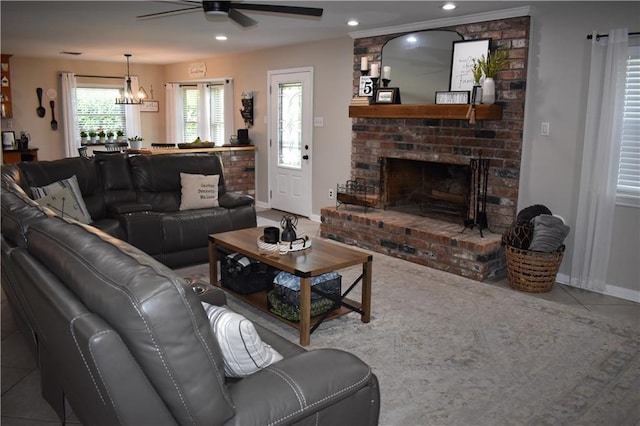 14 Platt St, Kenner, LA 70065 - tiled living room featuring a ceiling fan, a brick fireplace, recessed lighting, and a chandelier
