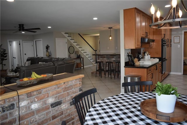 14 Platt St, Kenner, LA 70065 - dining area with light tile patterned floors, stairs, recessed lighting, a ceiling fan, and a chandelier
