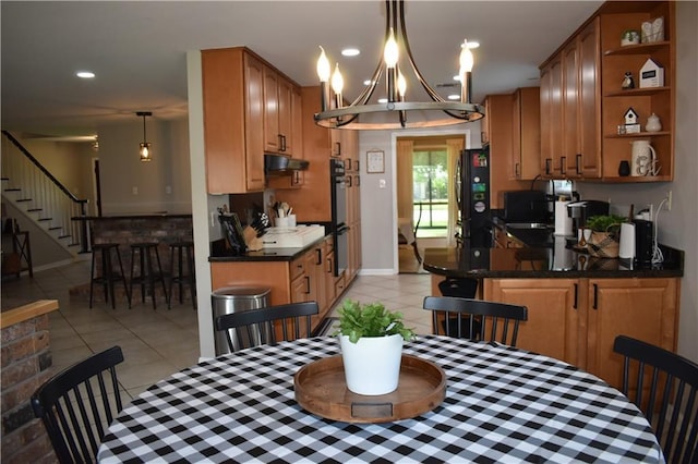 14 Platt St, Kenner, LA 70065 - dining space with light tile patterned floors, stairway, recessed lighting, and a chandelier