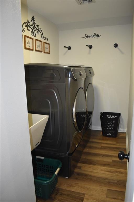 14 Platt St, Kenner, LA 70065 - washroom with separate washer and dryer and wood finished floors