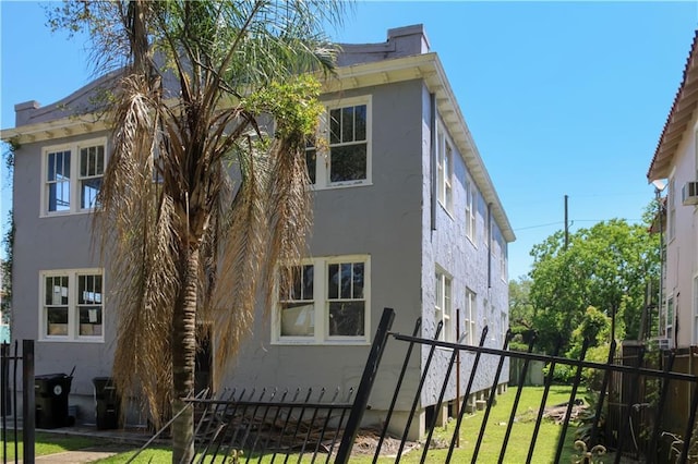 3435 Louisiana Avenue Parkway, New Orleans, LA 70115 - view of side of home with stucco siding