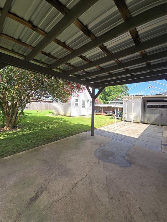 557 Grove Ave, Harahan, LA 70123 - view of vehicle parking featuring a carport