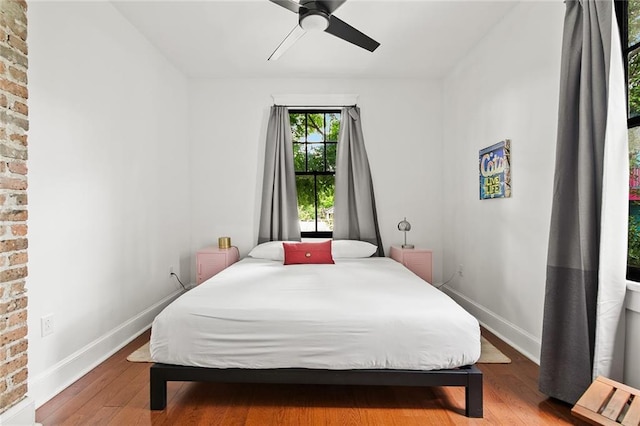 1039-41 Poland Ave, New Orleans, LA 70117 - bedroom featuring wood finished floors and a ceiling fan